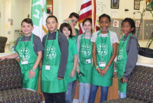4-H Club Officers wearing green 4-h aprons