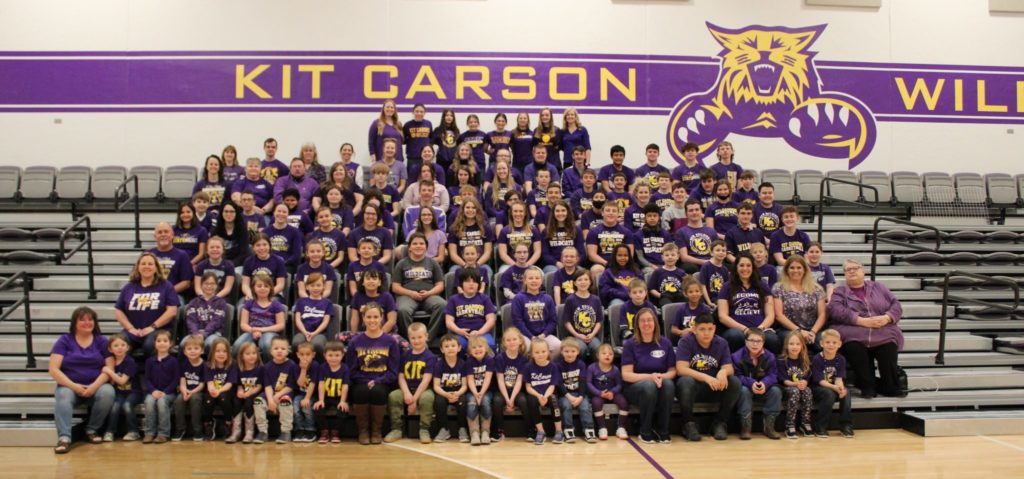Kit Carson students wearing purple seated in the Kit Carson gym