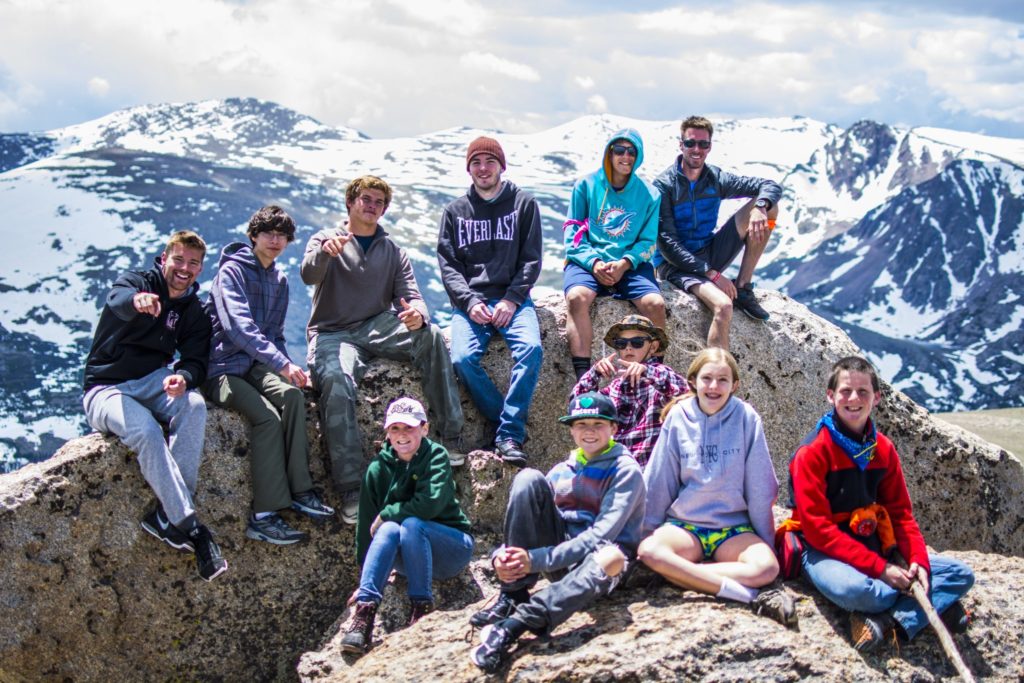 Teens participating inRocky Mountain Adventure Camp for military kids summit a mountain