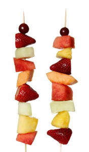 Two side by side fruit kabobs