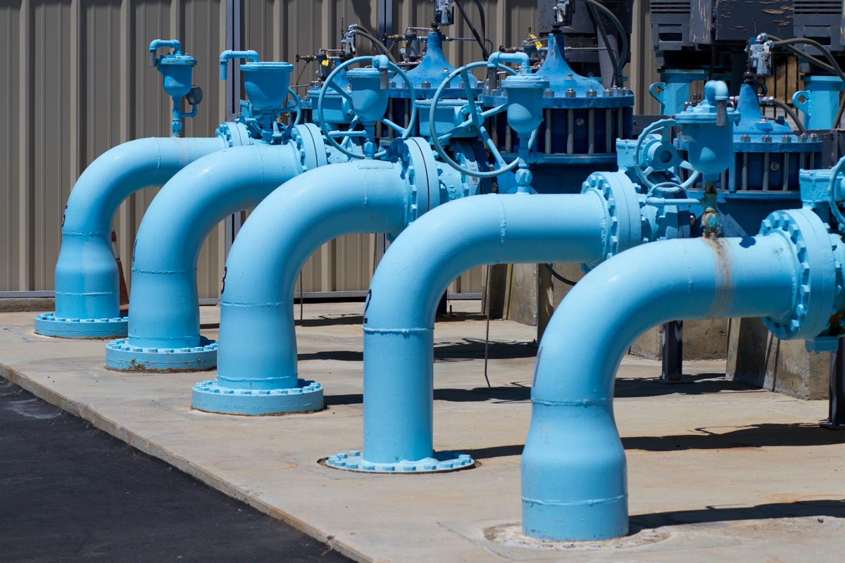 Water pumping transfer station with blue pipes