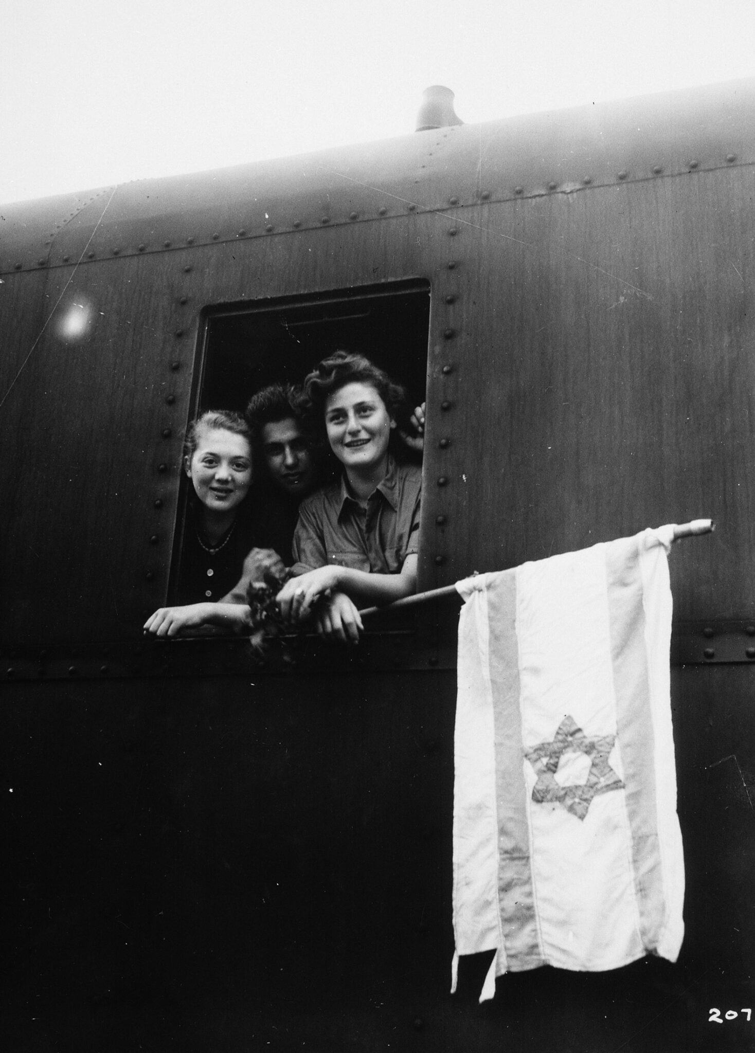 Jewish children hold a flag