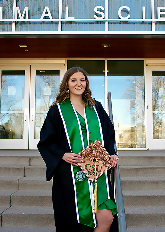 Brittany Dennison standing in front of CSU's animal sciences buildin